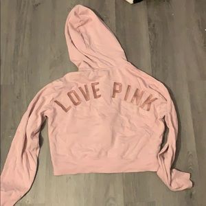 Pink zip up jacket.